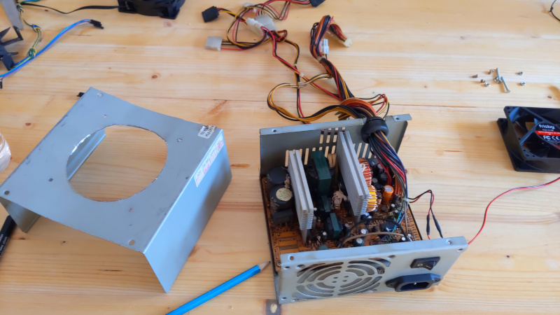 A cannibalized PSU with a jigsaw